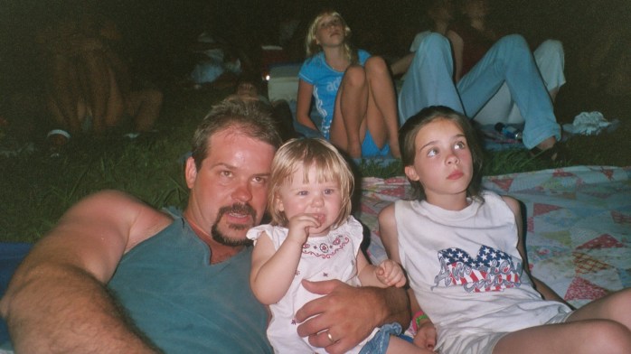 My hubby with our youngest and oldest 4th of July Fireworks (2002)
